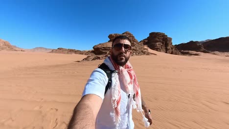 man walking through the desert alone