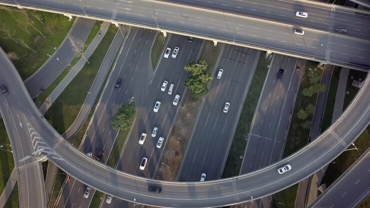 Top down angle aerial drone view of elevated road and traffic junctions in Chinese metropolis city Chengdu during sunny day