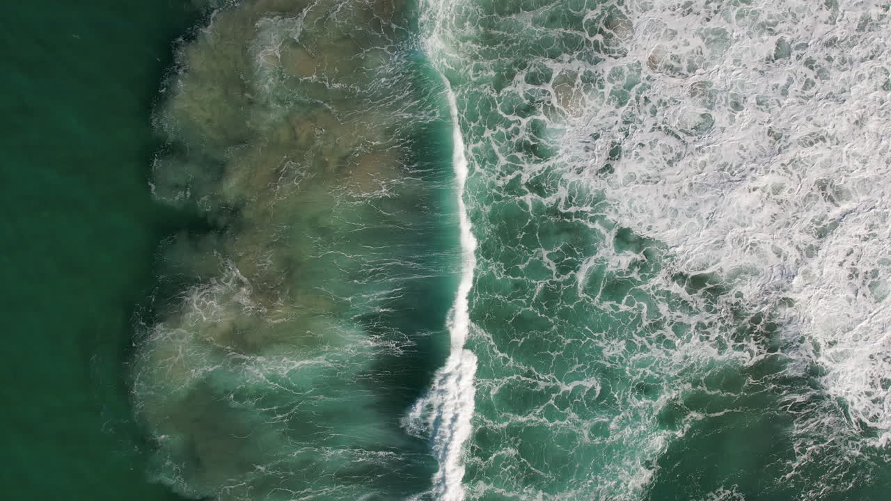 Beautiful texture of big power dark ocean waves with white wash