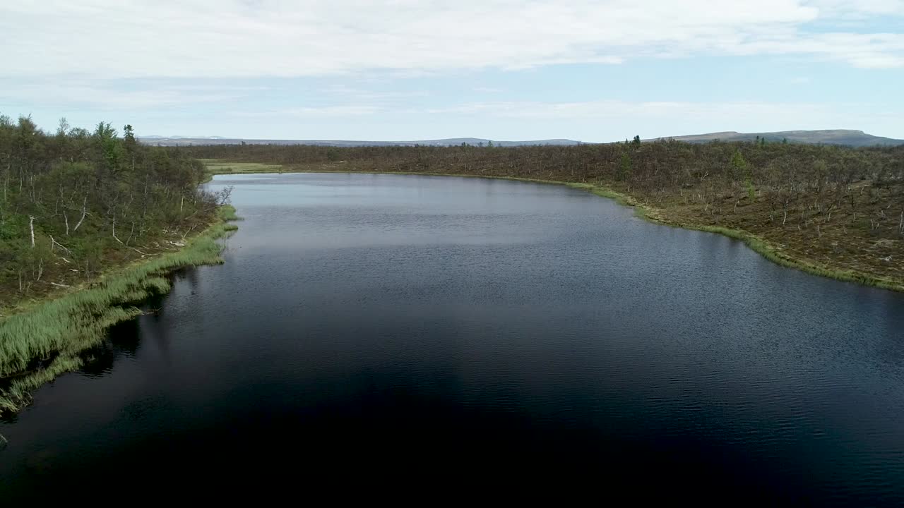 Scenic flight over a lake in the mountains