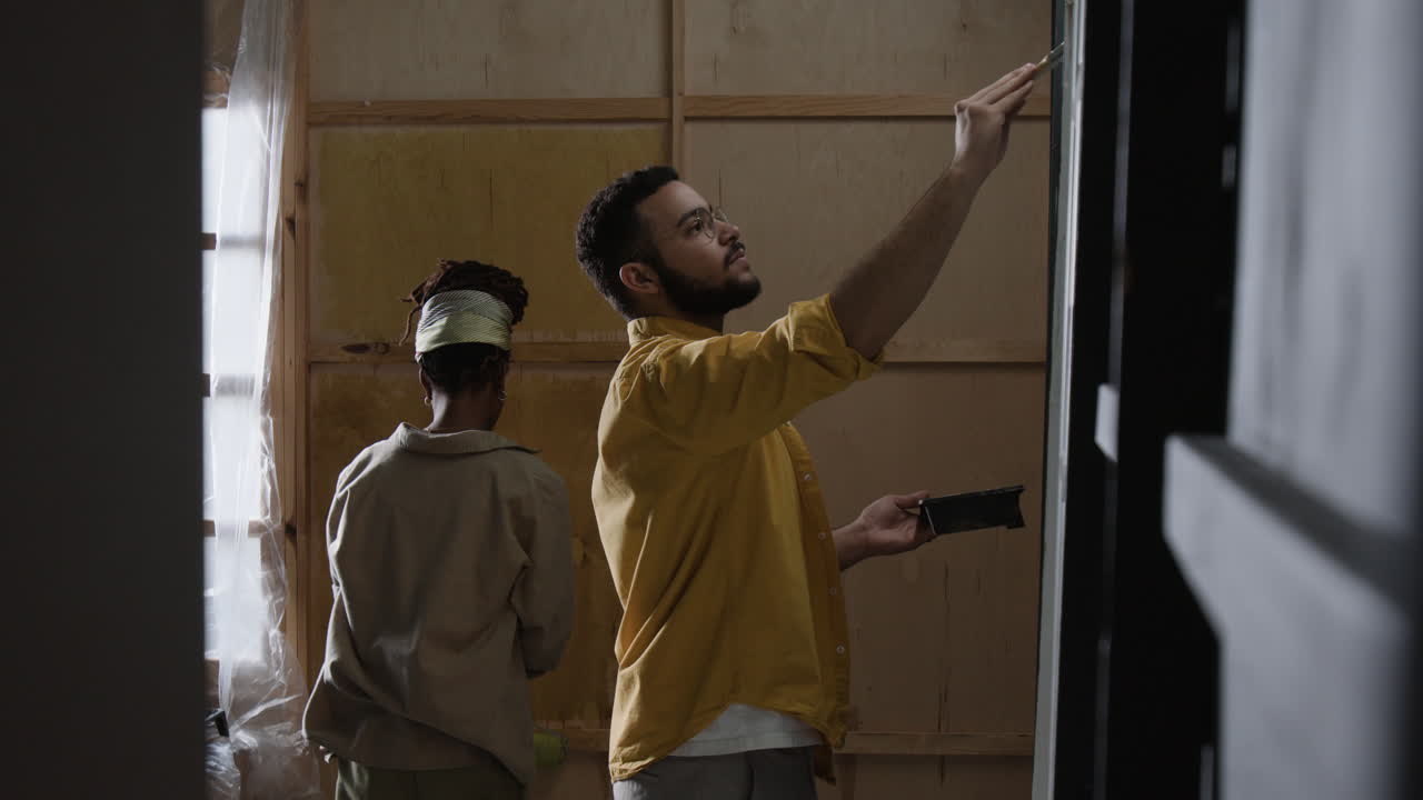 People painting the wall