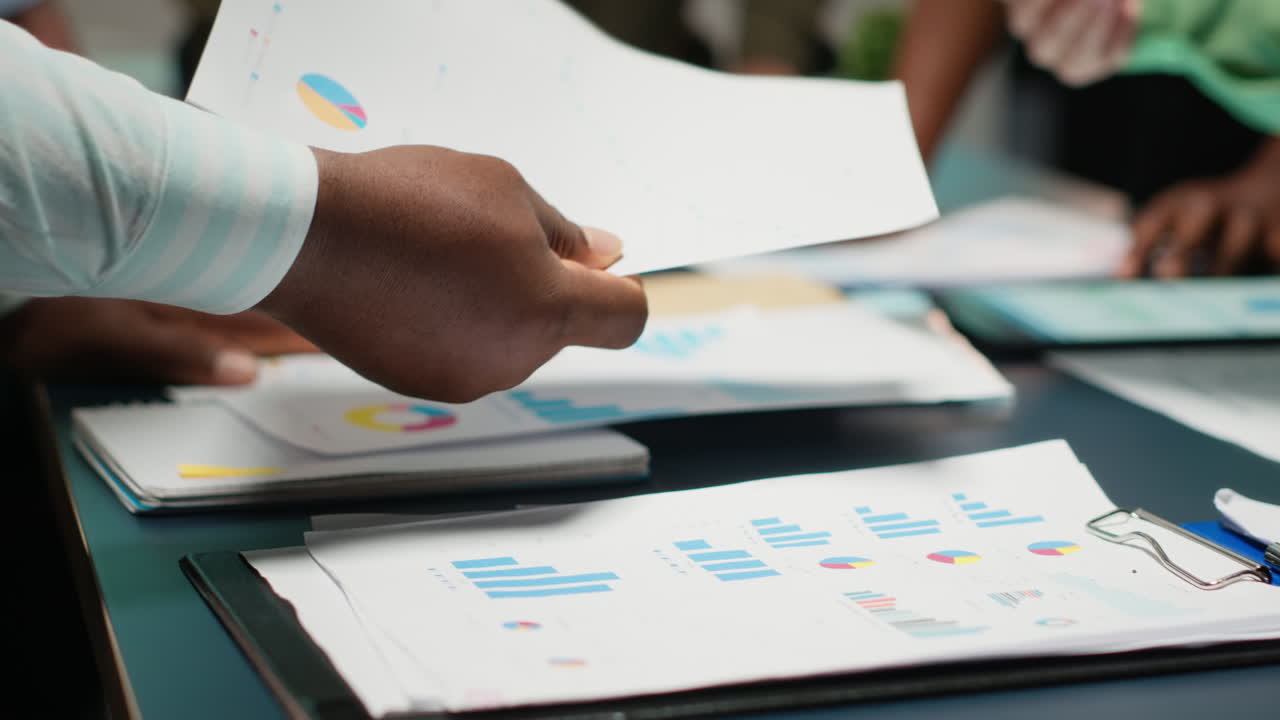 After hours briefing with multiethnic group gathering in a strategy room