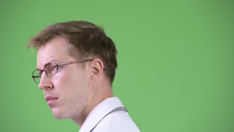 back view of young man doctor turning