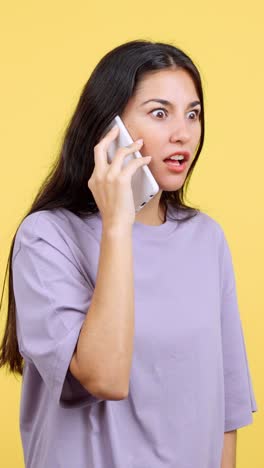 woman on phone reacting with shock and disbelief
