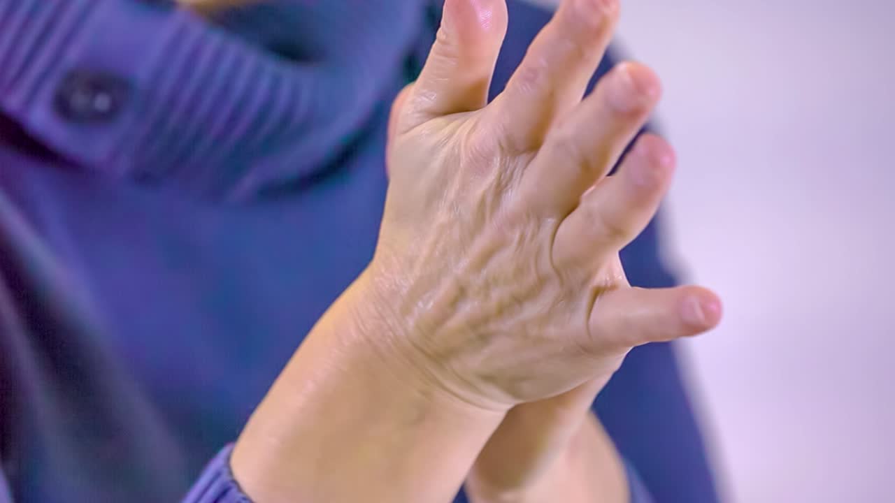 woman rub the hands with alcohol hand sanitiser against Coronavirus. Close-up