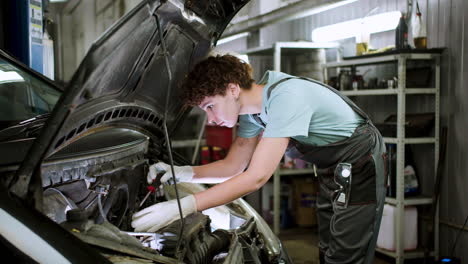 woman repairing car