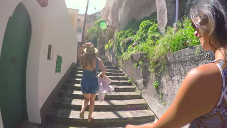 women walking up stairs in italy