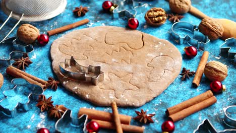 Christmas-baking-concept--Gingerbread-dough-with-different-cutter-shapes