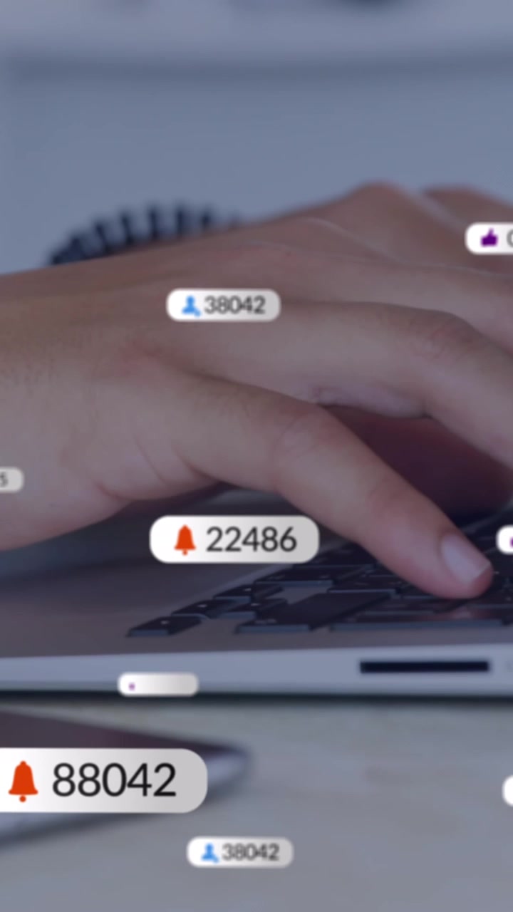 Animation of social media icons against mid section of businessman using laptop at office