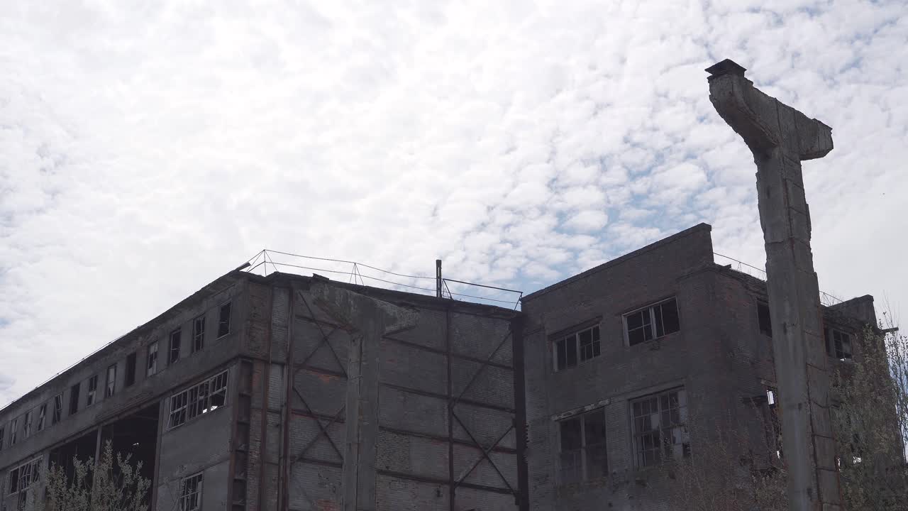 Destroyed buildings in the industrial park. Abandoned area of the old factory. Empty buildings, broken windows