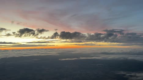 awesome colorful sunset from a jet cabin flying at 120000m high