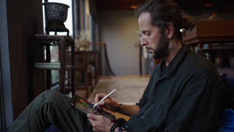 man creating digital art on a tablet