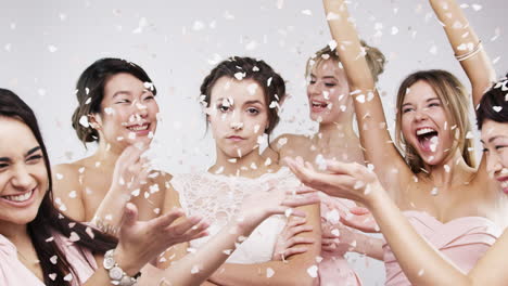 bride and bridesmaids in a celebratory photo