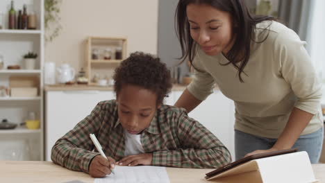 mother helping child with homework