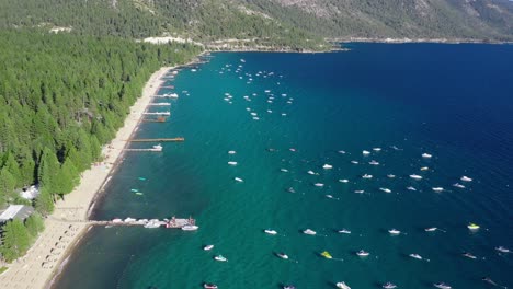 Boats-Floating-In-The-Calm-Blue-Waters-Of-Lake-Tahoe-With-Beach-At-Summer