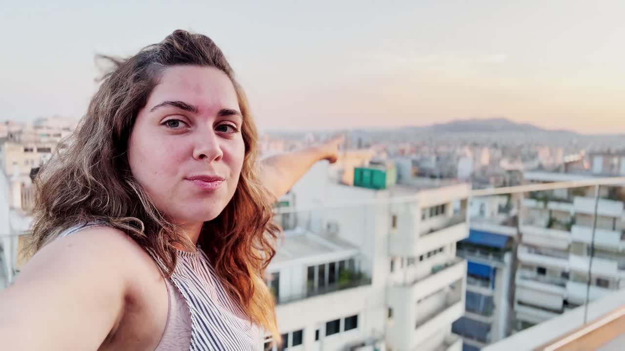Charming Vlogger Woman Capturing Selfie with Athens View