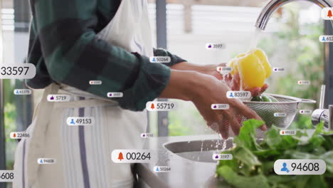 Cook washing bell peppers at kitchen sink, tracking marketing notifications via animated icons