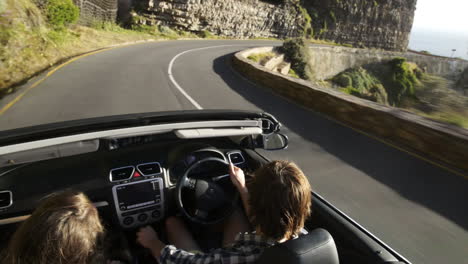 Couple-driving-convertible-car-cabriolet-cape-town-south-africa-steadicam-shot