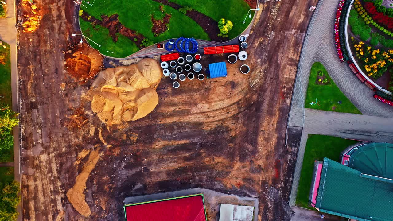 Ongoing road reconstruction and flower bed landscaping in Smiltene town square from above