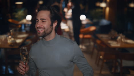 drinking man dancing party on restaurant celebration. happy guy enjoy fun in bar