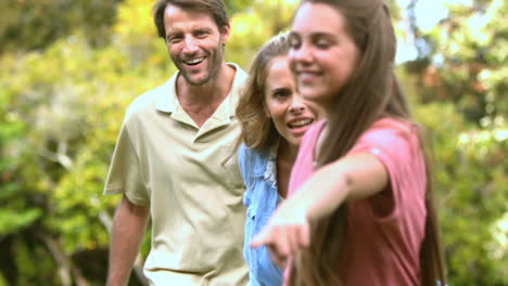 little girl pointing something to her parents