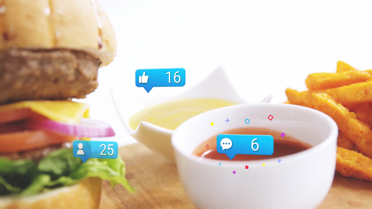 Burger and fries with social media notifications animation over wooden table