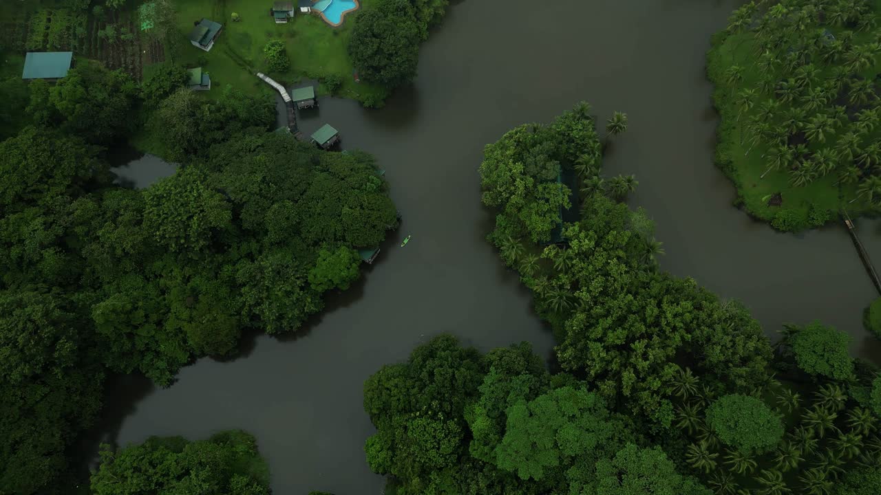 Lakes surrounded by trees and lush greenery in Laguna come into view, with a nearby swimming pool adding a unique touch to the natural scenery