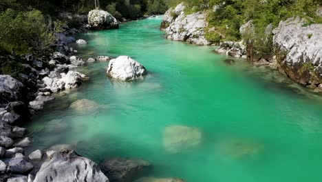 emerald green river in a canyon surrounded by forest