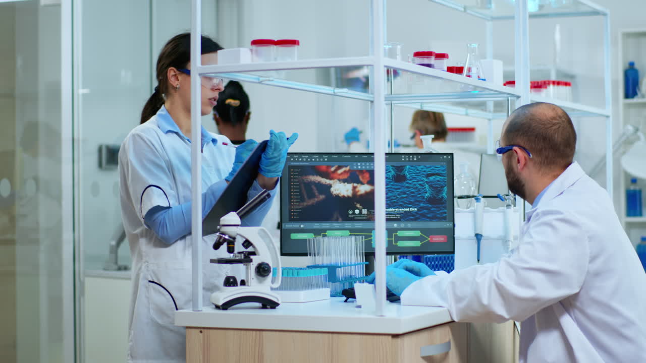 Multi ethnic team studying DNA mutations