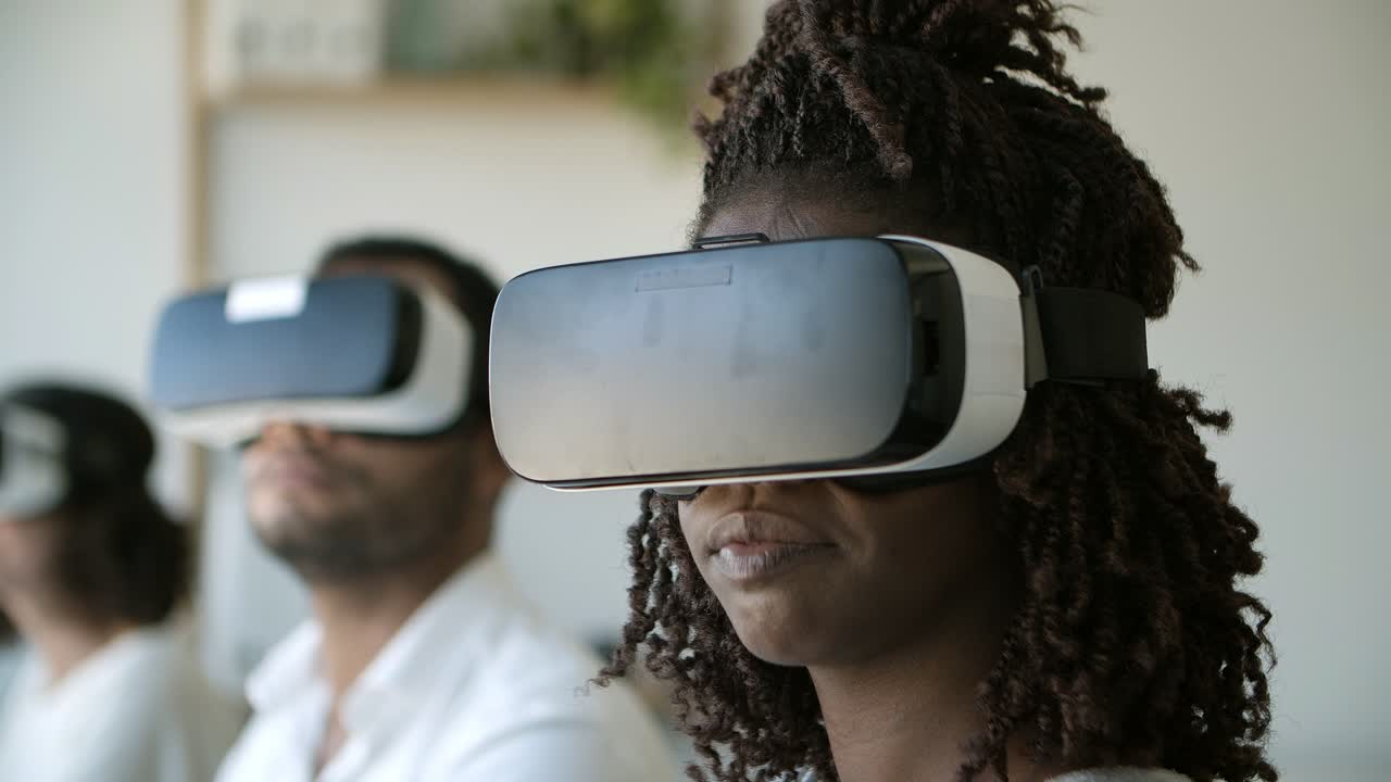 Closeup shot of smiling woman experiencing VR headset.