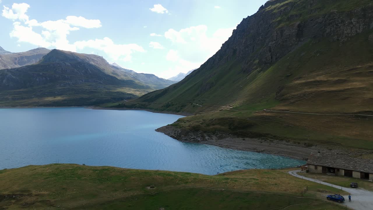 Mountain lake landscape with a lakeside building