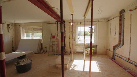 tracking shot on private construction site, entering a beautiful room with huge south facing window