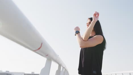 young woman stretching before running