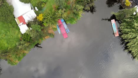 zenith view above trajineras of xochimilco, in mexico city, in a cloudy day