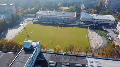 aerial view of a football field and stadium in a city