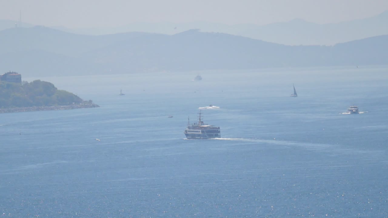 Ferry and boats on a calm bay