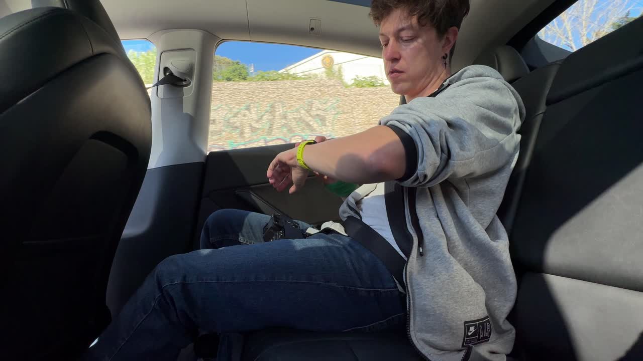 Person in the Backseat of a Tesla