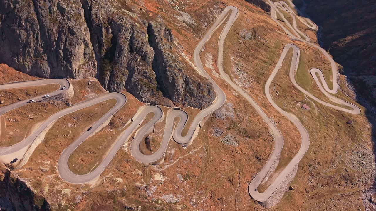 Curvy La Tremola road snakes over Swiss Gotthard Pass, aerial view
