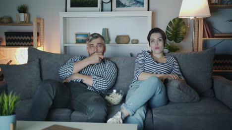 couple watching a movie at home
