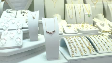 gold jewelery on jewelery rack