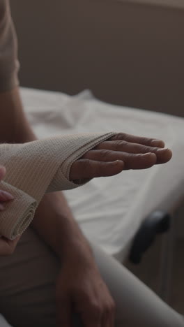 hand being wrapped with a bandage