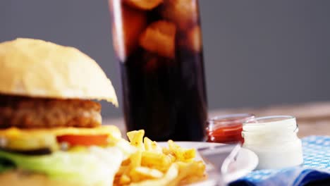 snacks and cold drink on wooden table