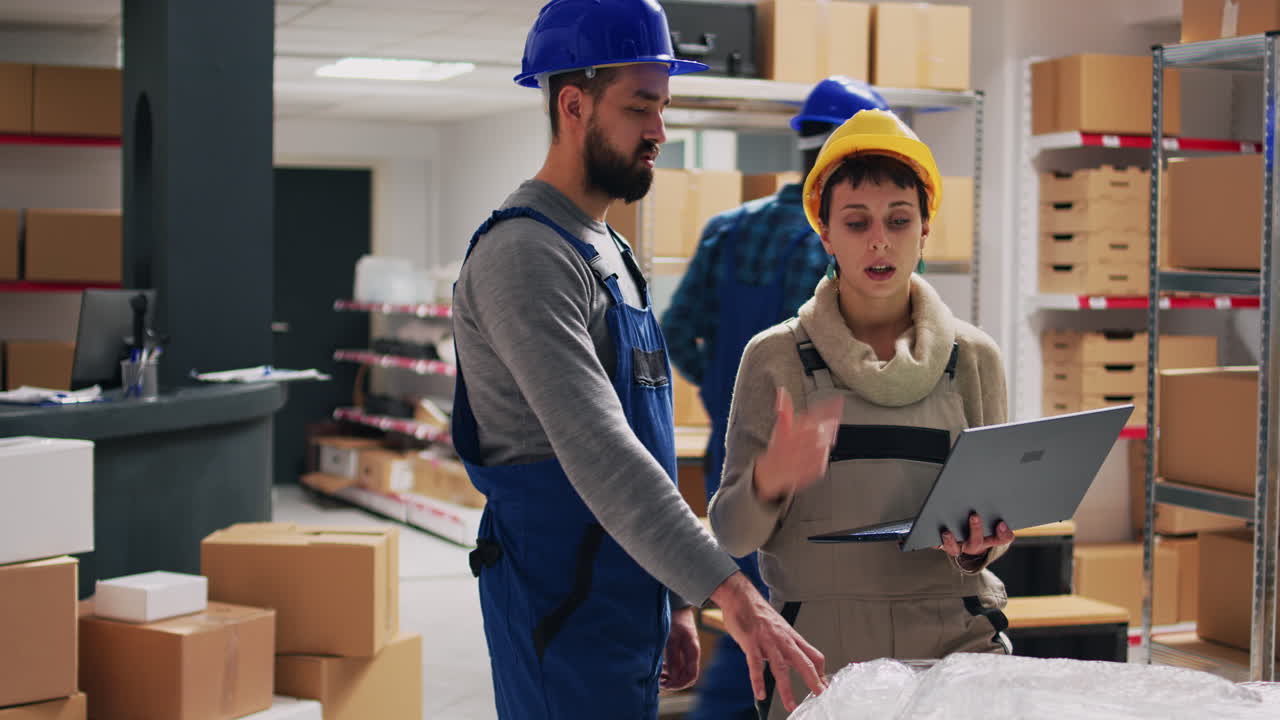 Warehouse workers in a warehouse with boxes and shelves