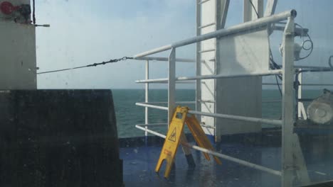 attention requiring yellow warning sign on the ferry
