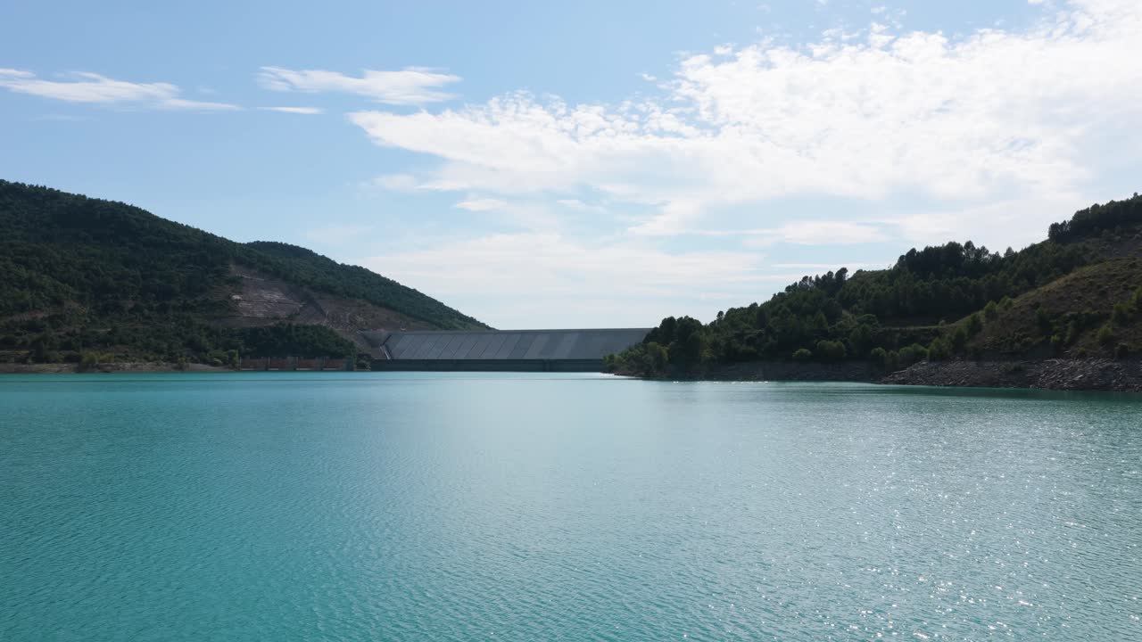 Scenic View of a Large Dam and Turquoise Reservoir Water