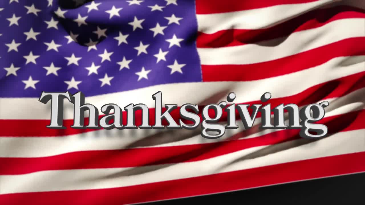 Animazione di testo bianco Thanksgiving su una bandiera americana che sventola