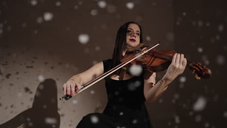 violinist in a winter studio