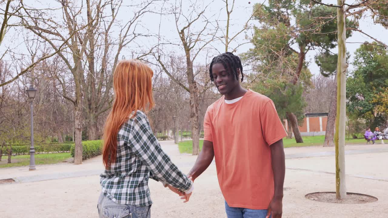 Couple holding hands in a park