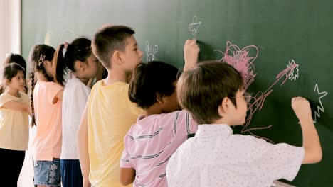 group of diverse young students standing together in classroom