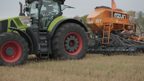 demonstration of agricultural machinery at an exhibition. tractors operate in the field, showcasing their capabilities and performance in action